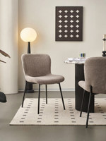 Chaise de salle à manger moderne minimaliste avec structure en acier et revêtement en lin, design haut de gamme durable pour salles à manger