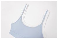 Ensemble de sport respirant 2 pièces pour femme : soutien-gorge de sport contrastant et jupe plissée de tennis avec short intégré