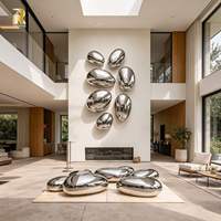 Sculpture murale en acier inoxydable poli miroir RELONG en forme de galet à vendre