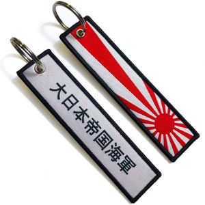 En gros Jet Tag Anime personnalisé avec logo tissé 'Remove Before Flight' - Product Image 1