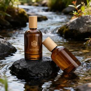 Botella de perfume de cristal ámbar en espray redonda al por mayor 30ml 50ml 100mL botella de perfume vacía con tapa de madera - Product Image 1