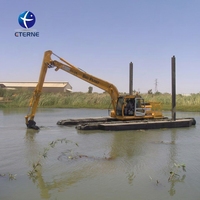 Excavatrice flottante amphibie électrique pour dragage de rivière avec bras de dragage hydraulique et flotteurs stabilisateurs pour zones humides et marécageuses