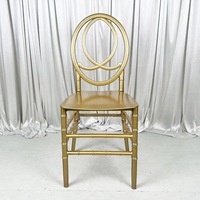Chaise Phoenix empilable à double dossier circulaire en plastique blanc et cristal doré pour mariages, banquets, dîners et événements