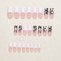 Bestseller transfrontalier : Autocollants pour ongles personnalisables, style français minimaliste blanc, motifs tête de mort et visage de fantôme d'Halloween, faux ongles.