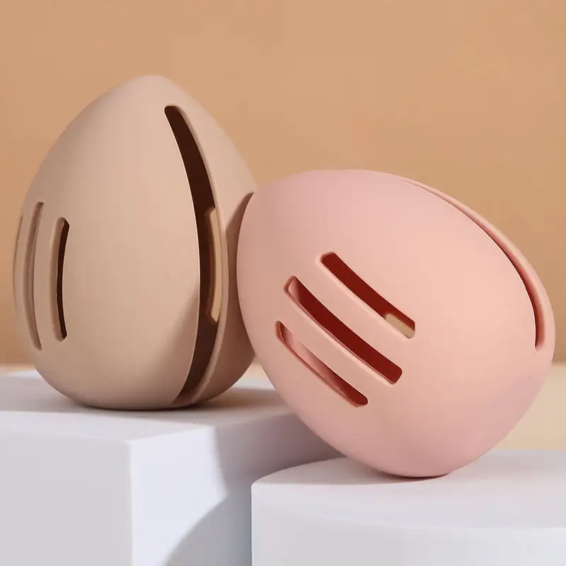 Grosir kualitas tinggi ramah lingkungan Kecantikan telur pemegang Make Up kasus berdiri wadah silikon Makeup spons