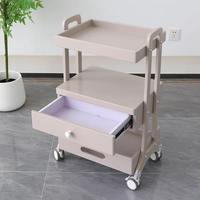 Dernière armoire de salon de tatouage d'art d'ongle multifonctionnelle moderne haut de gamme chariot de beauté en acier inoxydable avec support de rangement mobile
