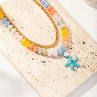 Collier ras du cou tendance pour femme avec pendentif étoile de mer en pierre naturelle et chaîne dorée colorée, idéal pour l'été et la plage