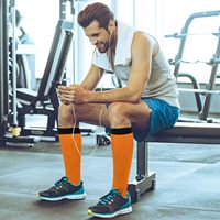 Chaussettes de compression montantes OEM 20-30 mmHg à imprimé orange pour le soutien athlétique et la santé, idéales pour la course et le cyclisme