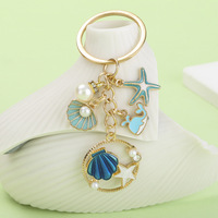 Porte-clés en alliage en forme de goutte d'huile, étoile de mer, dauphin, coquillage, pendentif cadeau, bijou de sac pour fille, exquis et haut de gamme