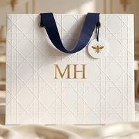 Sacs en papier de luxe personnalisés avec logo imprimé pour la promotion de vêtements, bijoux et cadeaux, avec poignée, vente en gros