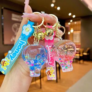 Thân Thiện Với Môi Phim Hoạt Hình Chất Lỏng Cát Túi Keychain Acrylic Hot Air Balloon Xe Mặt Dây Chuyền Dệt Kỹ Thuật Giữ Tiền Xu Quà Tặng - Product Image 1