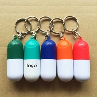 Mini porte-clés portable boîte à pilules vente directe d'usine PP matériel métal plastique Capsule porte-conteneur porte-clés pour les promotions
