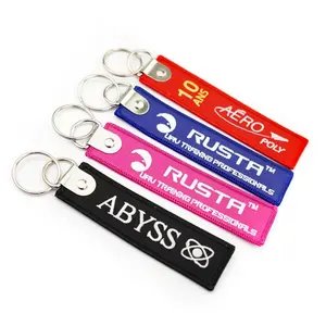 wholesale promotional gifts customized personalized jet tag design embroidery key chain customized Logo woven keychain