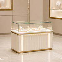 Vitrine de Luxe pour Bijoux avec Éclairage LED, Tiroirs de Rangement, Meuble de Comptoir Îlot Blanc Lait Doré pour Vente au Détail