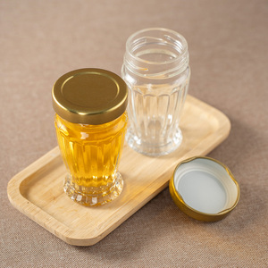 <span class=keywords><strong>Pot</strong></span> à miel en verre rond <span class=keywords><strong>vide</strong></span> <span class=keywords><strong>de</strong></span> 100 ml, sûr pour les aliments, à prix abordable, directement <span class=keywords><strong>de</strong></span> l'usine, avec couvercle sécurisé, idéal pour la <span class=keywords><strong>confiture</strong></span>, vente en gros - Product Image 1