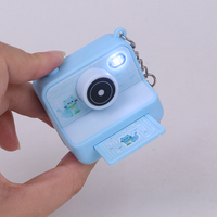 Nouveau design Mini Creative Instant Camera Keychain obturateur son et lampe de poche porte-clés
