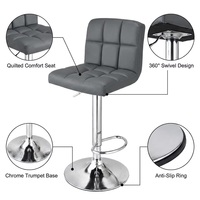 Tabourets de comptoir ergonomiques et élégants avec siège rembourré, base en cuir et métal, pivotants et réglables en hauteur pour appartement moderne, bar à domicile, pub ou salle.