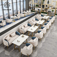 Meubles de table et de chaise de restaurant d'hôtel en marbre rond moderne de qualité supérieure, canapé de stand en cuir pour café, salon de thé