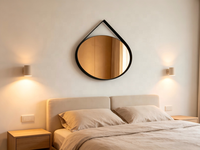 Miroir mural géométrique moderne avec verre teinté ambre et cadre en métal noir pour la décoration murale de la chambre, du salon ou de l'hôtel