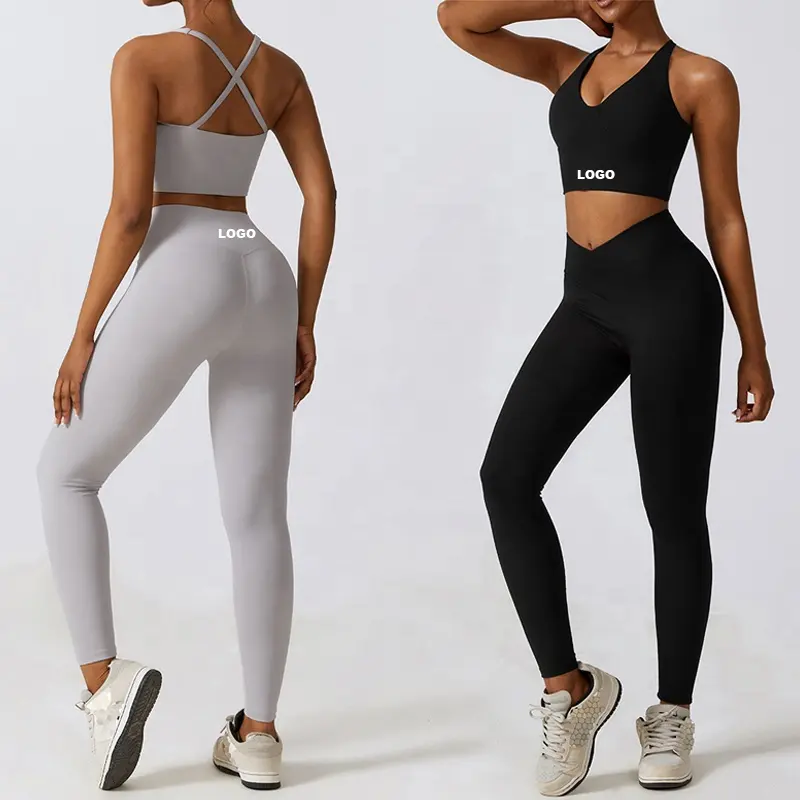 All'ingrosso donne palestra Fitness Wear reggiseno sportivo incrociato sul retro ad alto impatto e Leggings a vita incrociata con taglio a V Set da allenamento 2 pezzi