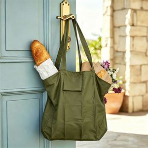 Bolsa Ecológica de Poliéster Compacta y Plegable con Bolsillo y Luz, para Compras Casuales y Almacenamiento de Viaje - Product Image 1