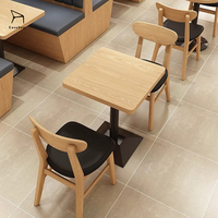 Ensemble table et chaises de haute qualité pour fournisseurs, avec coussins de siège en cuir confortables et durables, idéal pour les restaurants et les cafés