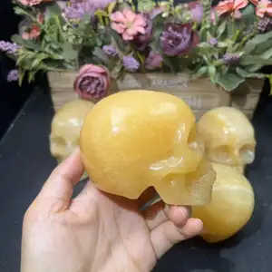Wholesale High Quality Hand Carved Natural Crystal Orange Calcite Skulls For Decoration