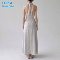 Produsen Gaun Maxi A-Line Wanita Model Halter Neck untuk Tamu Pernikahan dengan Saku Samping Tersembunyi OEM ODM