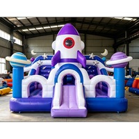 Château gonflable commercial en PVC avec toboggan, design astronaute, pour fêtes d'enfants, événements et locations de jeux.