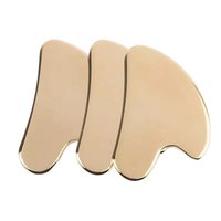 Outil de thérapie des tissus mous de masseur facial Gua Sha en cuivre avec panneau Guasha en métal et sac pour les produits de massage d'application du visage