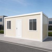 Maison modulaire préfabriquée crème avec porte centrale et fenêtres barreales pour projets résidentiels