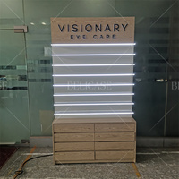 Présentoirs personnalisés pour lunettes de sport avec montures en bois, présentoirs à lunettes de soleil, meubles commerciaux pour lunettes connectées avec tiroirs et éclairage LED