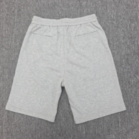 Shorts en tricot pour homme avec poche plaquée, gris chiné, taille élastique avec cordon de serrage, poche arrière à rabat avec embout métallique, coupe décontractée pour l'entraînement