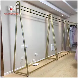 Sastrería moderna Boutique Golden Clothing Wall Rack y Metal Vestidos de novia Display Rack