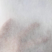 Tissu non tissé hydrophile perforé respirant à surface gaufrée pour couches pour bébés et serviettes hygiéniques