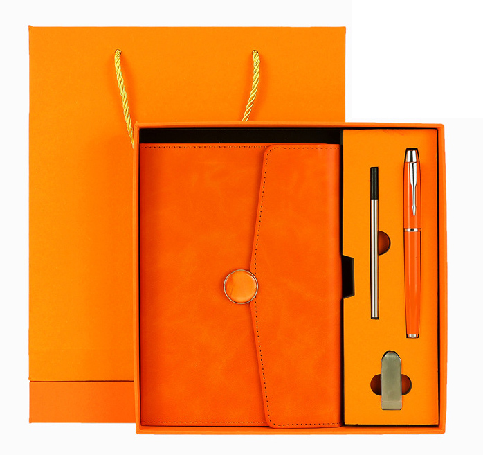 Cuaderno naranja+bolígrafo+USB