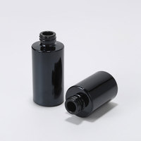 Flacon d'huile essentielle en verre noir de haute qualité 10ml 50ml 20ml 30ml Contenant cosmétique avec compte-gouttes automatique à bouton-poussoir noir