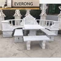 Table de jardin en marbre blanc avec banc