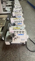 Machine à surjeter JUKI à quatre fils d'occasion, adaptée aux tissus fins à moyennement épais