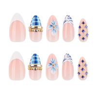 Vente en gros de faux ongles bleus à motifs floraux |   Base nude personnalisable avec imprimé zèbre et strass bleus, faux ongles élégants réutilisables
