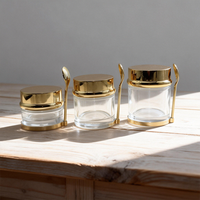 Vente en gros d'usine, pots de crème pour le visage en or rose et argent avec cuillère plate, 30g 50g 80g, ensemble d'emballage pour soins de la peau, pot en verre