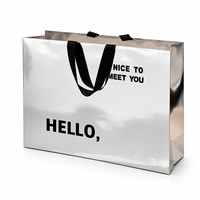 Sac cadeau en papier argenté métallisé personnalisé avec poignée en ruban, emballage de luxe pour boutique de marque