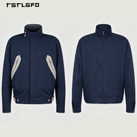 Veste utilitaire en toile bleu marine personnalisée, col montant, fermeture éclair intégrale, poches doubles sur la poitrine, poignets ajustables à l'avant, unisexe