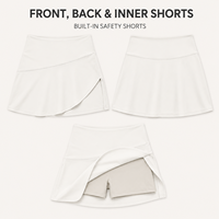 Jupe-short de tennis pour femmes, coupe irrégulière, avec short intégré, pour entraînement sportif et tenue de court.
