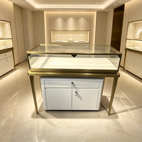 Vitrine à bijoux en acier inoxydable de luxe OEM avec éclairage LED, comptoir de bijouterie pour magasin de détail avec rangement à tiroirs