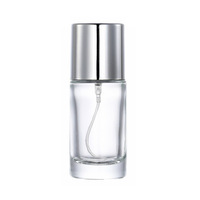 Bouteille de parfum en verre transparente cylindrique de 20ml mini capacité portionnement bouteille de parfum en verre vide avec pulvérisateur à pompe vente en gros