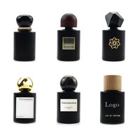 Emballage de bouteille de parfum de jet de cylindre du noir mat 50ml de style simple de luxe avec le couvercle et la boîte