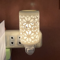 Diffuseur de cire électrique en céramique moderne, motif floral creux, prise américaine, lampe d'aromathérapie pour la maison, parfum d'ambiance et veilleuse
