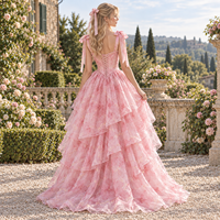 Robe de soirée formelle personnalisée pour femme en organza à imprimé floral, avec corset, bretelles à nœuds, volants superposés et jupe asymétrique