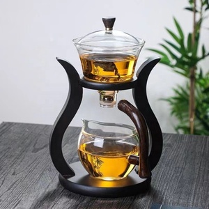 Juego de té de vidrio resistente al calor, tazón de tapa giratoria con dibujo de agua magnética, tetera semiautomática, tetera de goteo de Kung Fu Perezoso - Product Image 2